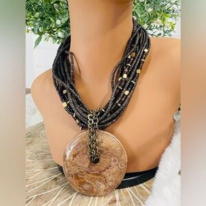 Chunky MultiStrand Bohemian Style Necklace with Round Carved Pendant